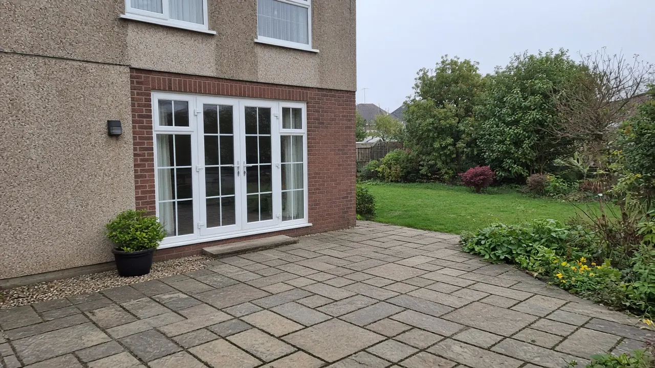 Example image: riven sandstone flags outside French doors on a 1930s semi